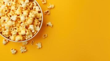 Popcorn viewed from above on yellow background. AI Generative Flat lay of pop corn bow photo