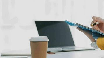 Businesswoman using calculators for do math finance on wooden desks in office and business working background, tax, accounting, statistics, and analytic research concept video