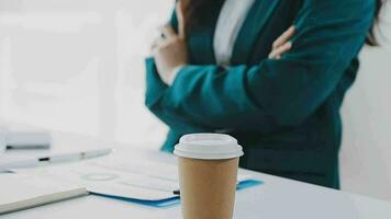 Businesswoman using calculators for do math finance on wooden desks in office and business working background, tax, accounting, statistics, and analytic research concept video