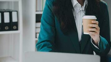 Businesswoman using calculators for do math finance on wooden desks in office and business working background, tax, accounting, statistics, and analytic research concept video
