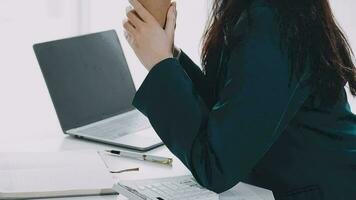Businesswoman using calculators for do math finance on wooden desks in office and business working background, tax, accounting, statistics, and analytic research concept video