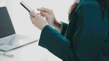Businesswoman using calculators for do math finance on wooden desks in office and business working background, tax, accounting, statistics, and analytic research concept video