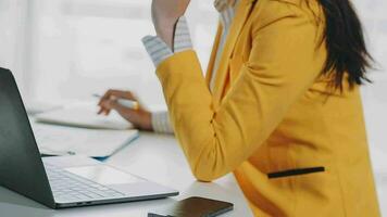Businesswoman using calculators for do math finance on wooden desks in office and business working background, tax, accounting, statistics, and analytic research concept video