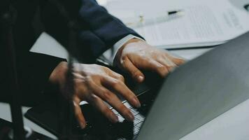 Business and lawyers discussing contract papers with brass scale on desk in office. Law, legal services, advice, justice and law concept picture with film grain effect video