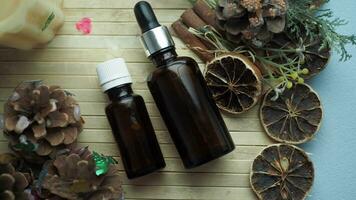 eucalyptus essential oils in a glass bottle with green leaf on white background video