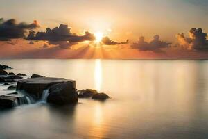 sunset over the ocean with rocks and water. AI-Generated photo