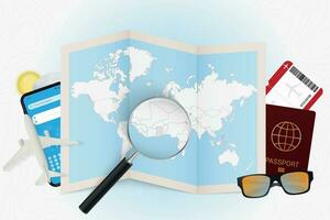 Travel destination Ghana, tourism mockup with travel equipment and world map with magnifying glass on a Ghana. vector