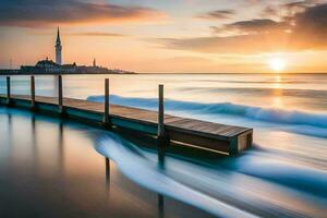 a pier in the ocean with waves and a church in the background. AI-Generated photo