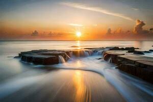 a beautiful sunset over the ocean with waves crashing into rocks. AI-Generated photo