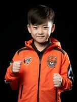 Young asian kid dressed in sportswear clearly active and full of energy AI Generative photo