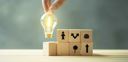 Creative idea, solution and innovation concept. Idea generation for business development. Wooden cube blocks with light bulb and cycle icons on clean background and copy space. AI Generative photo