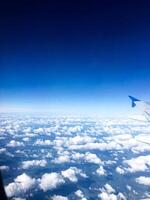 Airplane wing in the sky view photo