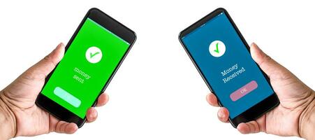 A man's hand holds a smartphone on the screen with the message money sent and received. Concept of financial transactions with mobile devices. Closeup, copy space on left for design. White background. photo