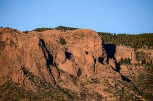 rock formations against a blue sky photo