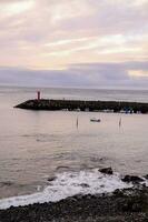 a view of the sea at dusk photo