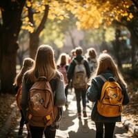 A group of happy young students, including a girl, and boy with a backpack, walk to school together, chatting and laughing as they enjoy their friendship and the excitement of learning. Generative Ai photo