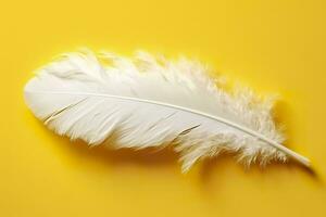 Close up of bright white feather. Copy space, yellow background. Fashion and Party concept. AI Generative photo