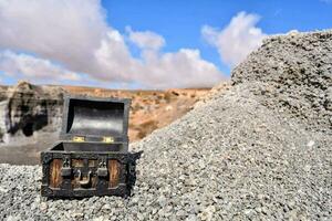 a small black box sitting on top of a rocky hill photo