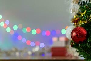 Christmas Tree In Bokeh and blur Background. Ornament And Abstract Defocused Lights. Concept Christmas Day, happy, highlights, holiday, light, merry, new year, night, season 2023. Copy space on left. photo