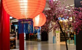 chinese lanterns In the Chinese New Year Festival February 2021. Chinese lanterns are lit up at night, decorated in a shopping mall. photo