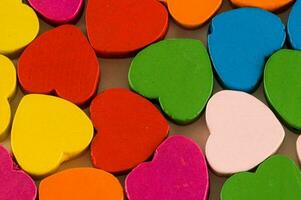 a pile of colorful wooden hearts photo