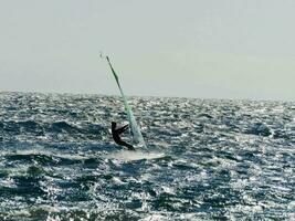 A person windsurfing photo