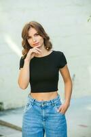 Portrait of a beautiful young woman with long brown hair smiling at the camera photo