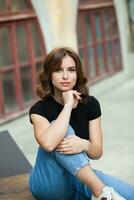 Close up portrait of a beautiful young woman smiling and looking at camera. White European girl with beautiful smile photo