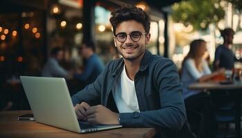 A young professional businessman sits at his desk, using his laptop computer to access the internet and work on business projects. generative ai photo