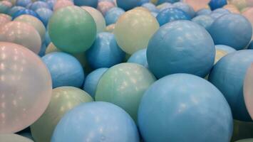 Colored plastic balls on balls pool for ball bath. Children fun activity photo