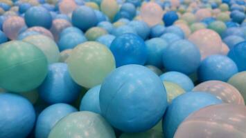 Colored plastic balls on balls pool for ball bath. Children fun activity photo