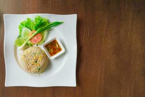 Top view Fried rice on white plate, Thai street food. photo