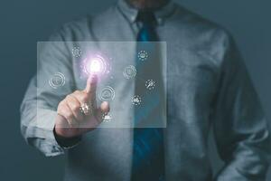 Cybersecurity and privacy concepts to protect data. Businessman touching to sign in for protecting personal data with virtual screen interfaces. login icon and internet network security technology. photo