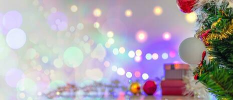 Christmas Tree In Bokeh and blur Background. Ornament And Abstract Defocused Lights. Concept Christmas Day, happy, highlights, holiday, light, merry, new year, night, season 2023. Copy space on left. photo