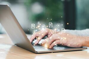 Online document database system and electronic document management system concept. Businessman working from home using laptop with virtual screen. Process data and manage files on Internet efficiently photo