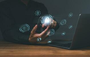 Businessman touching to sign in for protecting personal data with virtual screen interfaces. login icon and internet network security technology. Cybersecurity and privacy concepts to protect data. photo