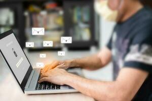 Work at home with computer and internet Laptop screen showing the login for online shopping. A man typing a keyboard key to use a computer network A laptop on a wooden table in a blurred background photo