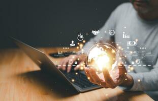 businessman Hand holding world digital Global Internet connection. Business global internet connection application IoT technology digital, marketing, financial, banking, Digital link tech, big data photo