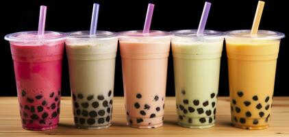 Plastic cups of different tasty bubble tea on wooden background. Generative AI photo