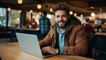 A young professional businessman sits at his desk, using his laptop computer to access the internet and work on business projects. generative ai photo