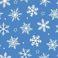 Seamless pattern with winter frosty ornament. White snowflakes of different shapes. Abstract vector graphics.