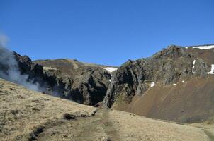 Volcanic Barren Landscape with Rolling Hills and a Valley photo