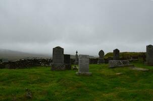 Gravestones at Dunvegan on the Isle of Skye photo