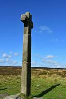 Tall Stone Cross That Acts as a Waymarker on the Moors photo