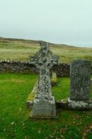 Stone Cross on the Isle of Skye in Scotland photo