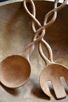 Wooden Salad Tongs in a Wood Salad Bowl photo