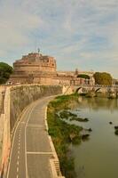 Breathtaking view of an Italian building next to a river photo