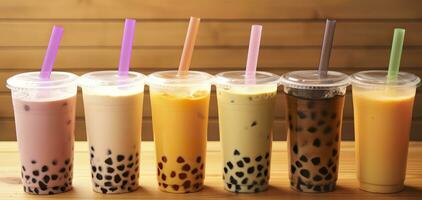 Plastic cups of different tasty bubble tea on wooden background. Generative AI photo