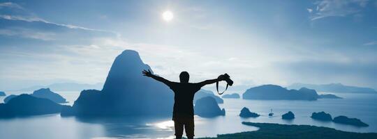 Men travel photography on the Mountain. Tourist on summer holiday vacation. Landscape Beautiful Mountain on sea at Samet Nangshe Viewpoint. Phang Nga Bay, Travel Thailand, Travel adventure nature. photo