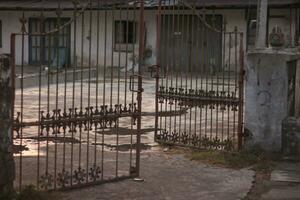 Ancient trellis fence made of iron with a unique shape. photo
